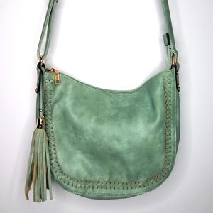 Mint green tasseled hobo purse.